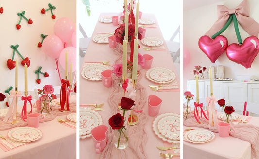 Cherry-themed tween Galentine’s Day party decor featuring a pink tablescape with heart-shaped balloons, cherry wall accents, floral centerpieces, and Valentine-inspired table settings arranged for a friendship celebration.