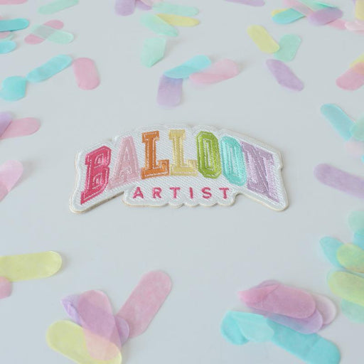 Balloon Artist patch in rainbow colors on a white patch.