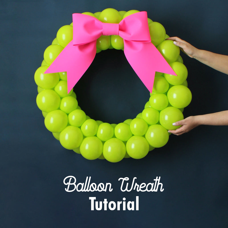 Lilly Jimenez's Balloon Wreath Tutorial teaches you how to make a vibrant, round wreath using only balloons—perfect for holiday decor, parties, and photo backdrops. Bright green balloons form a bold, modern wreath design that's fun and festive for any celebration.