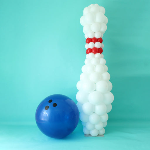 Bowling Pin Column Balloon Recipe featuring a 6.5ft white balloon pin with red accents, displayed next to a large blue balloon bowling ball on a teal backdrop. This digital recipe includes a PDF with balloon sizes, step-by-step instructions, a shopping list, and a PNG mockup file, making it perfect for creating sports-themed balloon decor for parties, school events, tournaments, and celebrations.