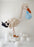 Elegant stork balloon design created with neutral balloons, standing on a cloud style base and holding a decorative balloon bundle, perfect for welcome baby displays, baby showers, and photography setups.