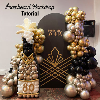 A glamorous Art Deco-inspired foamboard backdrop with gold geometric designs and the phrase "Party Like Zonia." The setup includes luxurious gold and black balloon arrangements and a striking champagne bottle balloon sculpture with metallic details, bubbles, and a "80" label. This elegant display is perfect for milestone celebrations and upscale event decor.