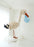 Large stork balloon display created with soft neutral balloons, featuring a tall curved neck, cloud style base, and a blue balloon bundle held in the beak, designed as a welcome baby statement piece for baby showers, newborn arrivals, nursery decor, and styled photography setups.