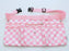 Light pink and white checkered maker apron with heart detail, featuring six pockets, a center zip pouch, belt loops, and grommets for attaching tools. Includes an adjustable strap with a side-release buckle for a secure and comfortable fit. Designed for balloon artists, event decorators, and creative professionals, this stylish and functional workbelt offers ample storage for tools and accessories.