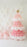 Pink balloon Christmas tree made with layered pink and white balloons, topped with a gold star balloon. White balloon snowflakes cover the wall behind it, with soft pastel pink balloons at the base creating a cute winter backdrop for holiday decor and Christmas party photo setups.