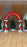 Santa’s Workshop red and white balloon arch with holiday lettering, candy cane style columns, Christmas trees, and nutcracker accents, ideal for festive photo backdrops, Santa events, and winter balloon decor displays.