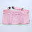 Solid light pink maker apron with six pockets, including a center zip pouch, belt loops, and grommets for tool attachments. Features an adjustable strap with a side-release buckle for a secure and comfortable fit. Displayed on a white background, this stylish and functional workbelt is ideal for balloon artists, event decorators, and creative professionals needing organized storage for tools and accessories during events.