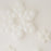 Clustered white balloon snowflakes in multiple sizes lay against a clean white background. Each snowflake is made from small round balloons arranged into layered six-point shapes, creating a bright winter look. The mix of large and small designs adds dimension, making these balloon snowflakes perfect for holiday parties, winter wonderland themes, and seasonal photo backdrops.