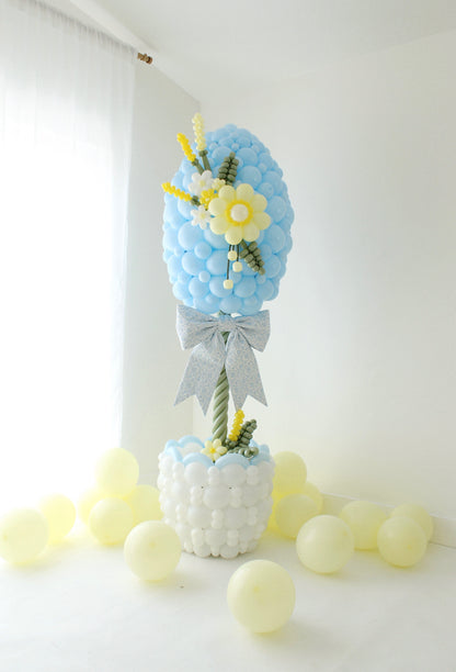 close up of Easter egg balloon column with balloon flower detail and layered design for spring balloon decor
