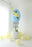 close up of Easter egg balloon column with balloon flower detail and layered design for spring balloon decor