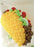 Side view of large balloon taco sculpture showing shell and layered filling details