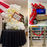 Cinema party decor class collage featuring a giant balloon popcorn bucket, red movie night balloon garland with film strip details, oversized film reel props, gold star balloons, and red carpet balloon stanchions for Hollywood themed parties and watch party decorations.