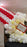 Giant balloon popcorn bucket close-up with red and white striped balloons, white popcorn balloon clusters, yellow butter accents, and a marquee popcorn sign for cinema party decor, movie night birthdays, Hollywood themed events, and watch party displays.