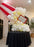 Giant balloon popcorn bucket made with red and white striped balloons, white popcorn balloon clusters, yellow butter accents, and a marquee popcorn sign for cinema party decor, movie night birthdays, Hollywood themed events, and watch party displays.