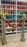 Red carpet balloon stanchions made with gold balloon columns and a red balloon rope for cinema party decor, movie night entrances, Hollywood themed parties, VIP areas, and photo op displays.