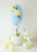full Easter balloon column topiary setup with basket base, egg design, and balloon flowers for spring party decor