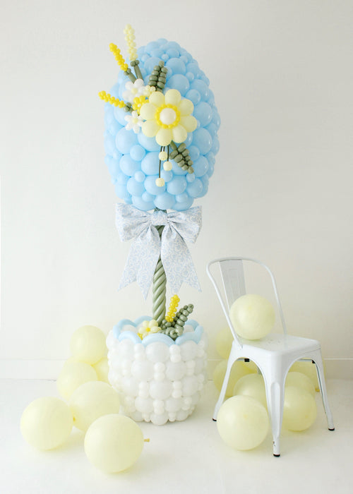 full Easter balloon column topiary setup with basket base, egg design, and balloon flowers for spring party decor