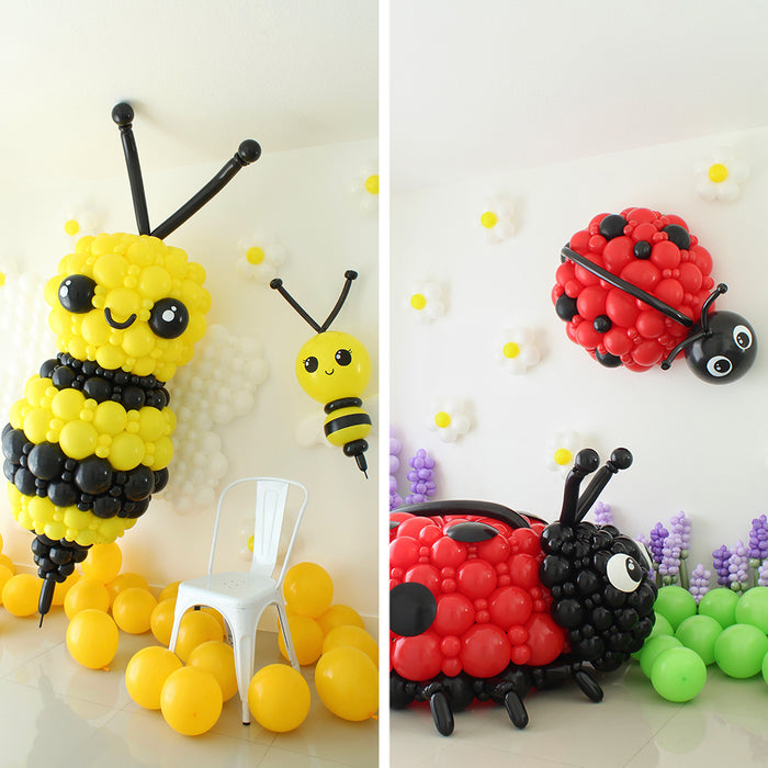 Giant balloon bee and ladybug sculptures created by Lilly Jimenez for the Giant Balloon Bugs Class. Oversized balloon bug decor featuring a yellow and black bumble bee and red ladybug with black spots, designed for spring parties, garden theme balloon decor, birthday backdrops and professional event installations.