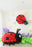 Large balloon ladybug sculpture with red clustered body and black detailing displayed in a spring garden balloon setup. Oversized bug decor paired with green balloon ground clusters and floral accents for birthdays and event backdrops.