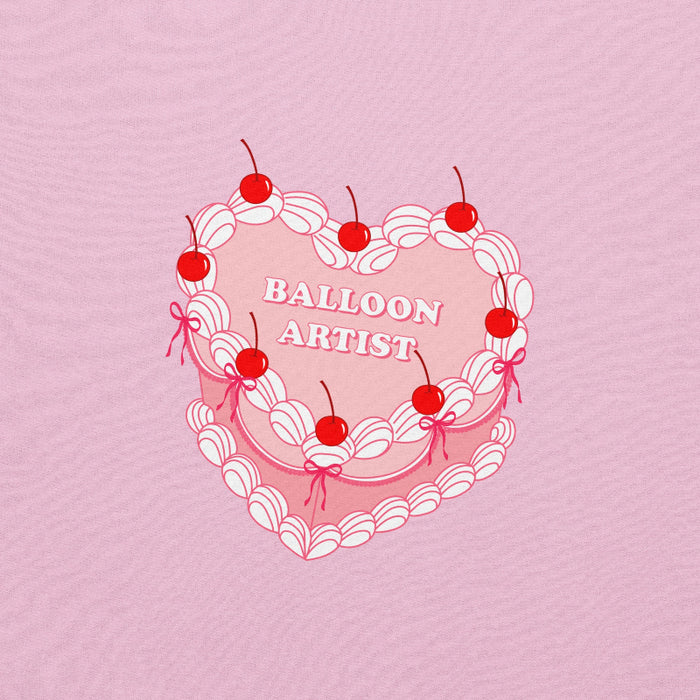 a vintage-inspired heart cake design with cherries, white piping details, and the text "Balloon Artist" in the center.