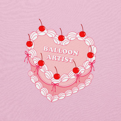 vintage-inspired heart cake design with cherries, white piping details, and the text "Balloon Artist" in the center.